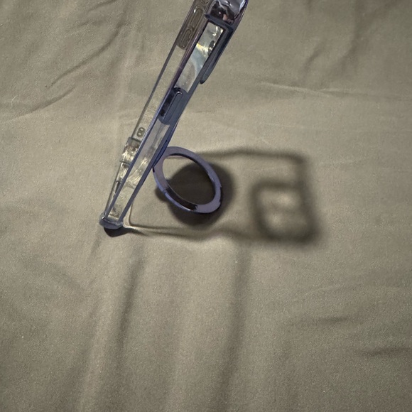 Clear Phone Case with Blue Accents For a 15 Pro Max. Spinning wheel in Center. - Picture 6 of 14